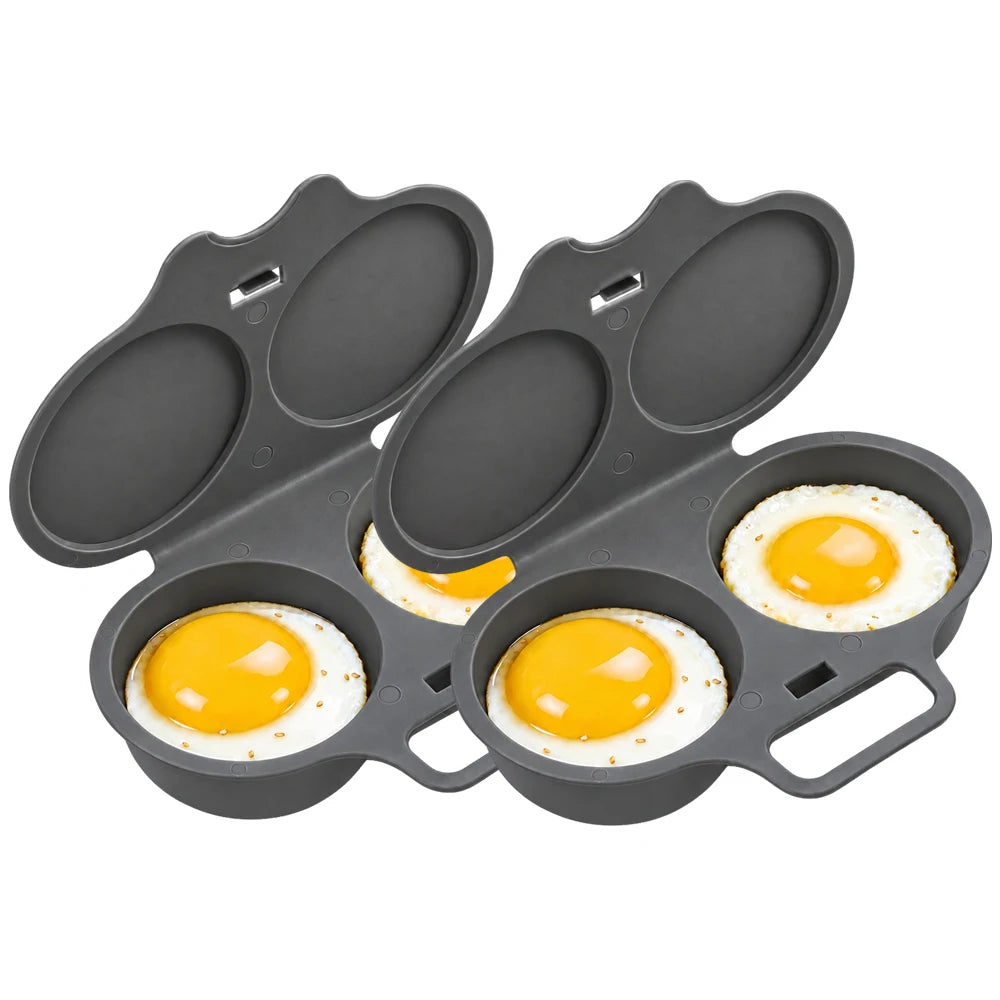 A dark gray silicone egg cooker with three oval-shaped egg-casting wells, shown open with two eggs cooked inside on a white background.